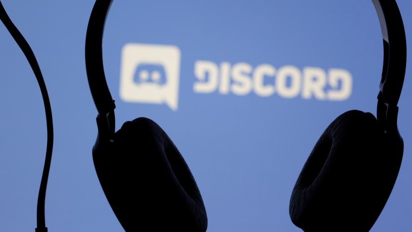 Headphones are seen in front of displayed Discord app logo in this illustration taken March 29, 2021. REUTERS/Dado Ruvic/Illustration