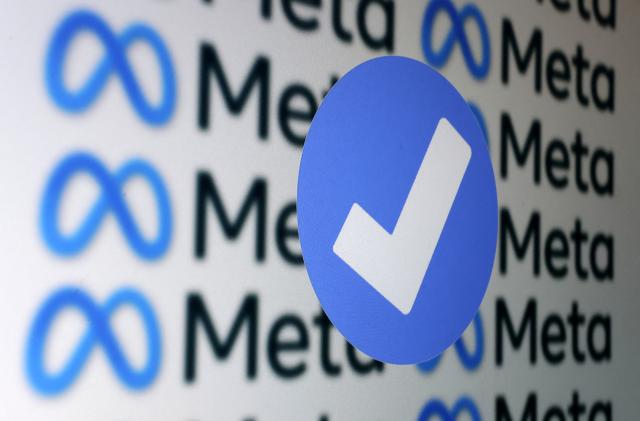 A blue verification badge and Meta logos are seen in this illustration taken January 19, 2023. REUTERS/Dado Ruvic/Illustration