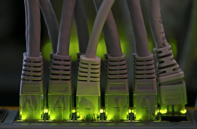 LAN network cables plugged into a Bitcoin mining computer server are pictured in Bitminer Factory in Florence, Italy, April 6, 2018. Picture taken April 6, 2018. REUTERS/Alessandro Bianchi