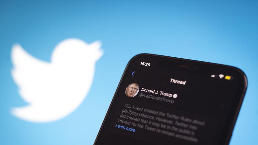 A tweet by US president Donald Trump is seen being flagged as inciting violence by Twitter in this photo illustration on an Apple iPhone in Warsaw, Poland on May 29, 2020. Twitter on May 29 applied a fact-checking label to a vote-in-mail tweet by US President Donald Trump that the company considers misleading. Twitter has recently started labelling tweets with public notification and fact check labels. The labelling of Trump's tweet about the uproar following the death of George Floyd has seen the president signing an executive order targeting the Communications Decency Act. Section 230 which protects social media companies against lawsuits against them for user generated content. (Photo Illustration by Jaap Arriens/NurPhoto via Getty Images)