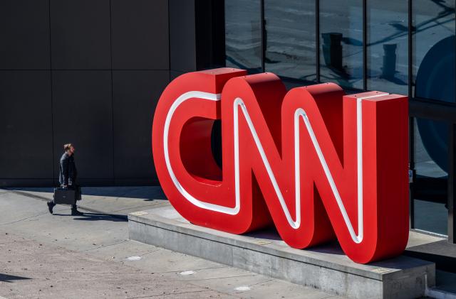 ATLANTA, GEORGIA - NOVEMBER 17: A person walks into the world headquarters for the Cable News Network (CNN) on November 17, 2022 in Atlanta, Georgia. CNN's CEO and Chairman, Chris Licht, has confirmed that the company will begin layoffs in early December.  (Photo by Brandon Bell/Getty Images)