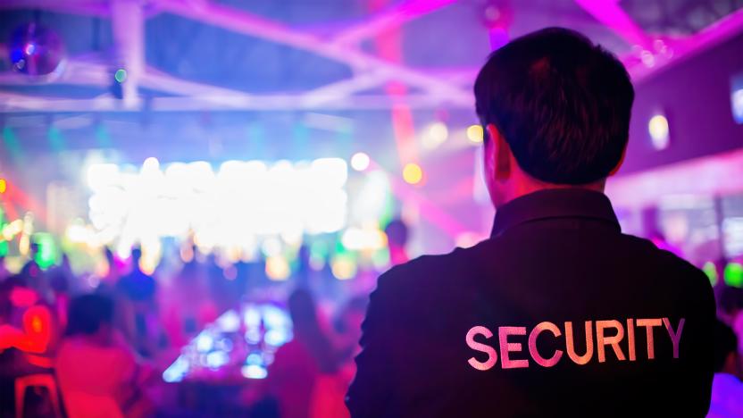 Security guard  are regulating the situation of safety in an event concert in a nightclub.