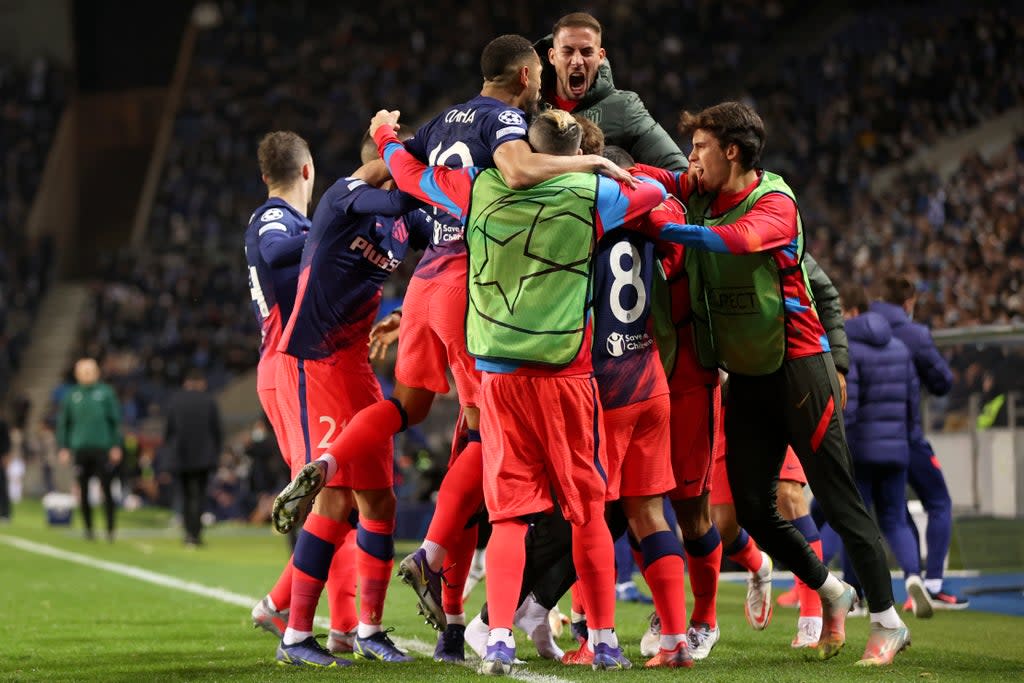 atletico madrid reach knockout phase with dramatic win over porto