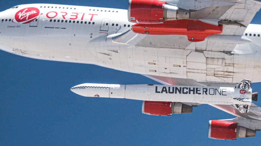 A photo of Virgin Orbit's carrier aircraft with a LauncherOne rocket attached to its belly.