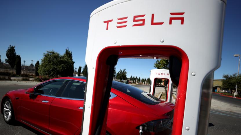 PETALUMA, CALIFORNIA - SEPTEMBER 23: A Tesla car sits parked at a Tesla Supercharger on September 23, 2020 in Petaluma, California. California Gov. Gavin Newsom signed an executive order directing the California Air Resources Board to establish regulations that would require all new cars and passenger trucks sold in the state to be zero-emission vehicles by 2035. Sales of internal combustion engines would be banned in the state after 2035. (Photo by Justin Sullivan/Getty Images)