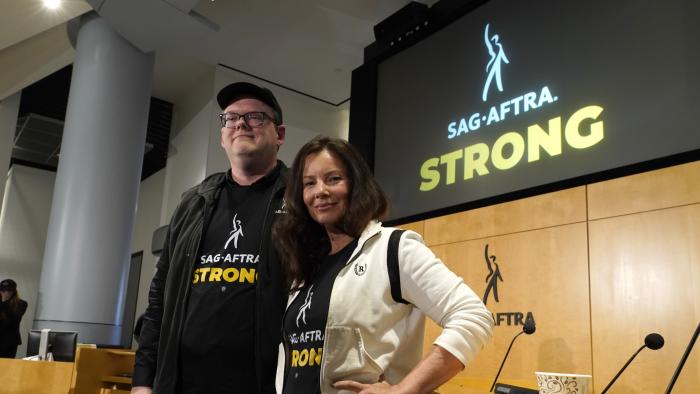 SAG-AFTRA president Fran Drescher, right, and SAG-AFTRA National Executive Director and Chief Negotiator Duncan Crabtree-Ireland appear following a press conference announcing a strike by The Screen Actors Guild-American Federation of Television and Radio Artists on Thursday, July, 13, 2023, in Los Angeles. This marks the first time since 1960 that actors and writers will picket film and television productions at the same time. (AP Photo/Chris Pizzello)