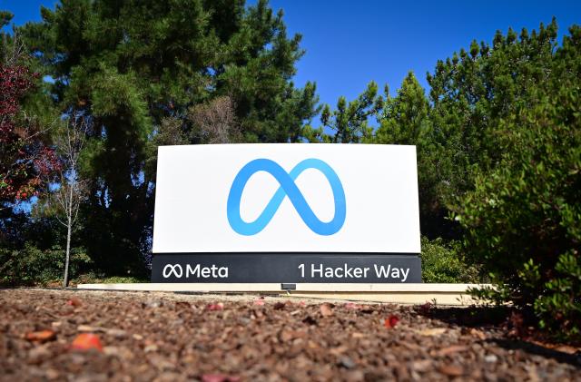 The Meta (formerly Facebook) logo marks the entrance of their corporate headquarters in Menlo Park, California on November 09, 2022. - Facebook owner Meta will lay off more than 11,000 of its staff in "the most difficult changes we've made in Meta's history," boss Mark Zuckerberg said on Wednesday. (Photo by JOSH EDELSON / AFP) (Photo by JOSH EDELSON/AFP via Getty Images)