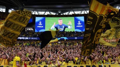 Getty Images - Borussia Dortmund supporters cheer prior to the UEFA Champions League final football match between Borussia Dortmund and Real Madrid, at Wembley stadium, in London, on June 1, 2024. (Photo by Adrian DENNIS / AFP) (Photo by ADRIAN DENNIS/AFP via Getty Images)