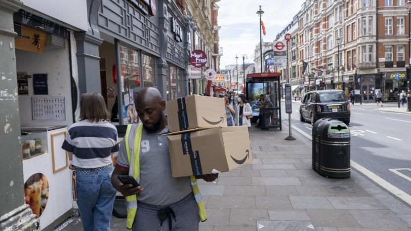 Delivery man with packages from Amazon Prime in Soho on 17th May 2022 in London, United Kingdom. Amazon Prime is a paid subscription service from Amazon which is available in various countries and gives users access to additional services otherwise unavailable or available at a premium to other Amazon customers. Services include same, one or two-day delivery of goods. (photo by Mike Kemp/In Pictures via Getty Images)