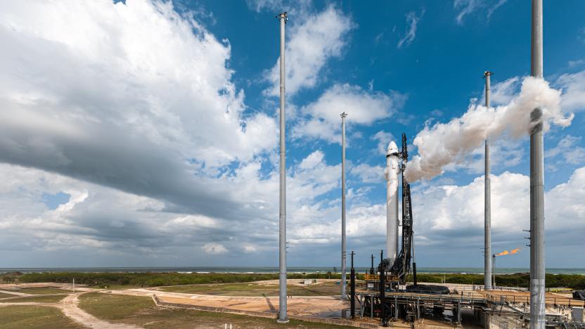 Relativity Space's Terran 1 rocket against a background of blue sky, clouds and palm trees.