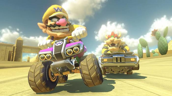 Wario and Bowser racing in a still from Mario Kart 8.
