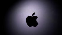 FILE PHOTO: Apple logo is seen on the MacBook in this illustration taken taken April 12, 2020. REUTERS/Dado Ruvic/Illustration/File Photo