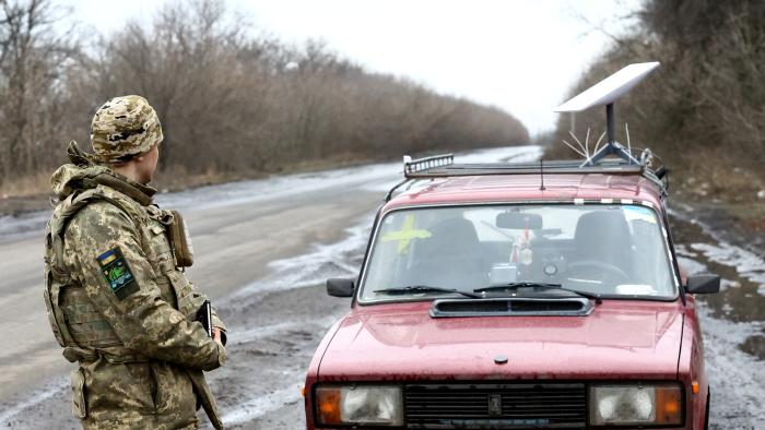 A Ukrainian serviceman stands next to a vehicle that carries a Starlink satellite internet system near the frontline, as Russia's attack on Ukraine continues, in Donetsk region, Ukraine February 27, 2023. REUTERS/Lisi Niesner