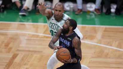 Associated Press - Dallas Mavericks guard Kyrie Irving drives toward the basket as Boston Celtics center Al Horford (42) defends during the first half of Game 1 of basketball's NBA Finals on Thursday, June 6, 2024, in Boston. (AP Photo/Charles Krupa)