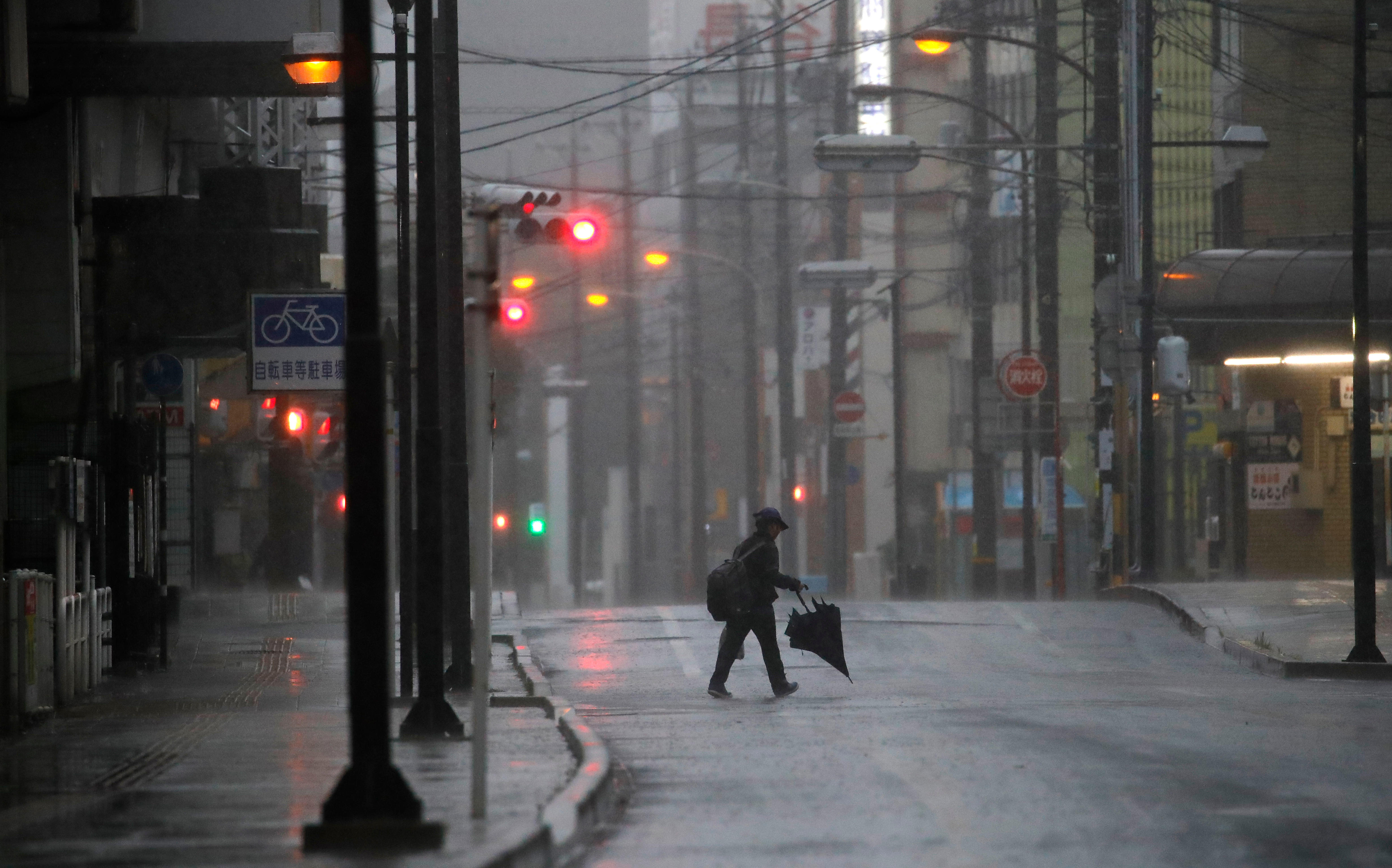 Tokyo area shuts down as powerful typhoon lashes Japan