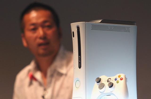 TOKYO - MAY 13: Microsoft's new Xbox360 game console is introduced during a press preview on May 13, 2005 in Tokyo, Japan. The machine is equipped with IBM's PowerPC on its CPU, 20GB HDD and 512MB RAM, and has a wireless controler. (Photo by Koichi Kamoshida/Getty Images)