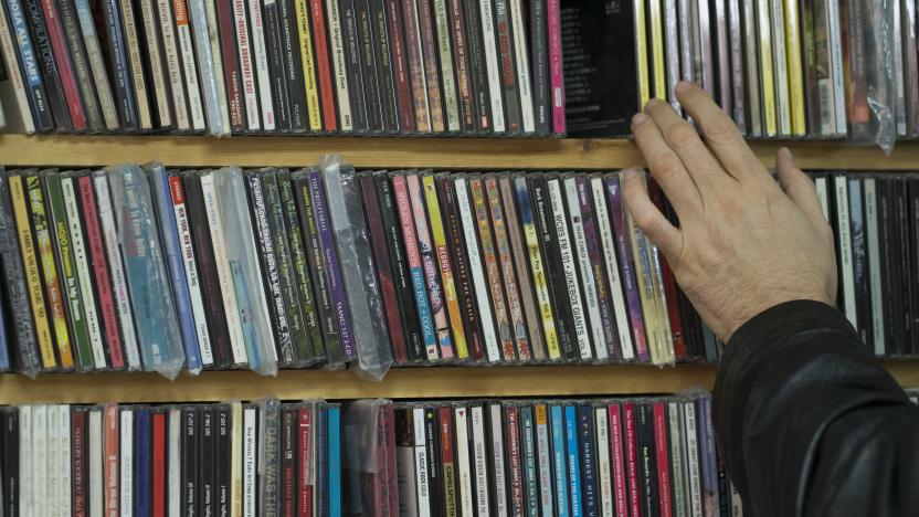 TORONTO, ON - DECEMBER 14: A man uses his fingers to flip through the CD stack. Vortex Record Store  founder and owner, Bert Myers, is closing his business after nearly four decades in business.        (Rick Madonik/Toronto Star via Getty Images)