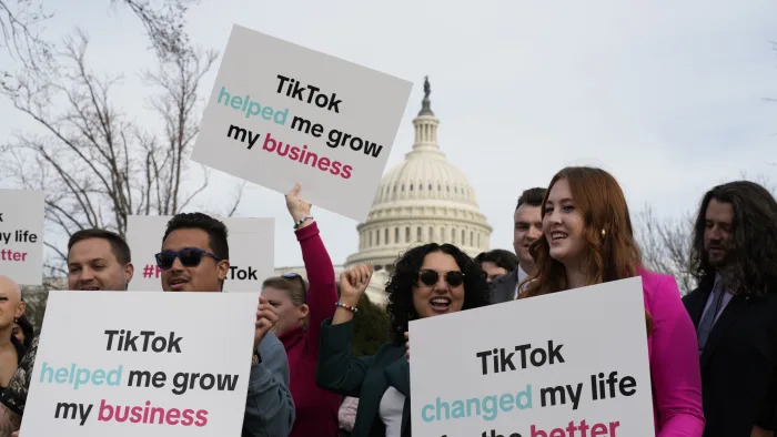 Devotees of TikTok gather at the Capitol in Washington, as the House passed a bill that would lead to a nationwide ban of the popular video app if its China-based owner doesn't sell, Wednesday, March 13, 2024. Lawmakers contend the app's owner, ByteDance, is beholden to the Chinese government, which could demand access to the data of TikTok's consumers in the U.S. (AP Photo/J. Scott Applewhite)