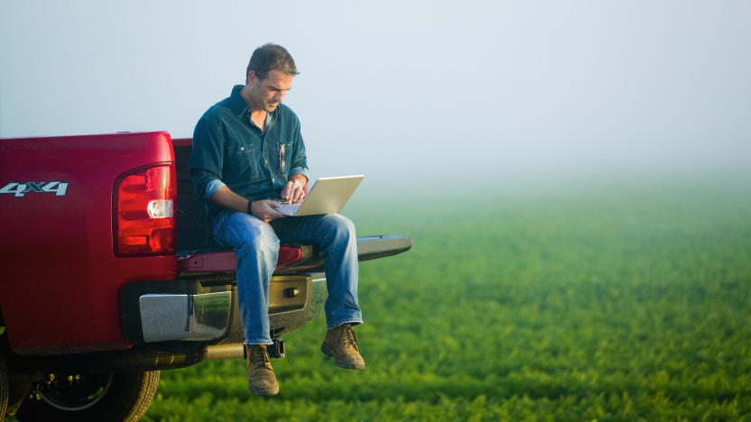 Farmer Using Laptop from Tailgate of Truck