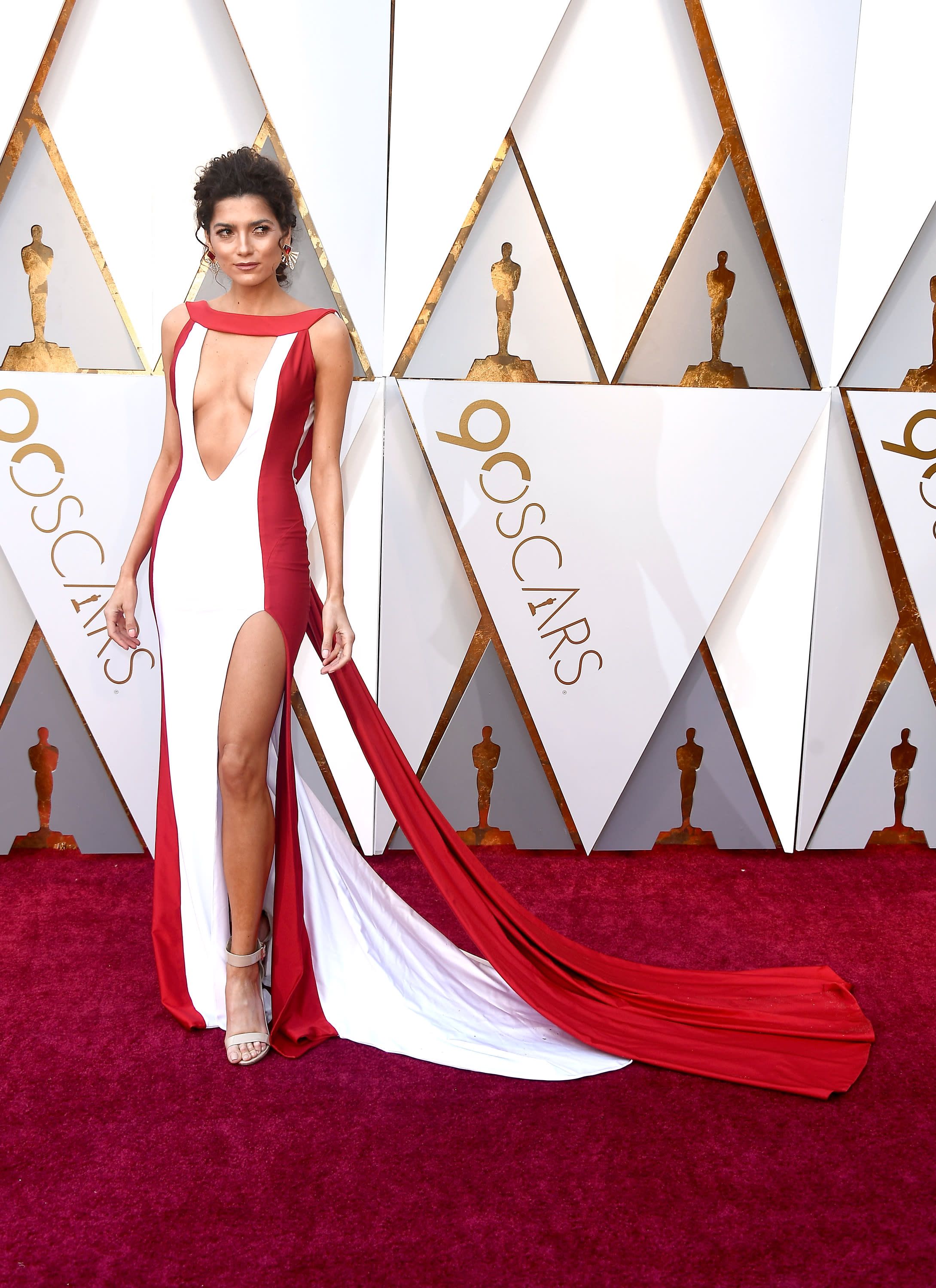 Actress Blanca Blanco wears a red gown to the Oscars that's basically a  'wardrobe malfunction waiting to happen