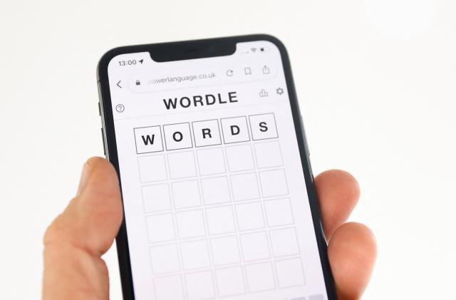 Wordle, a website-only word game played on mobile phones and tablets, is displayed in this picture illustration taken February 1, 2022. REUTERS/Andrew Boyers/Illustration