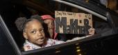 Children carry a sign at a Black Lives Matter protest. (Getty Images)