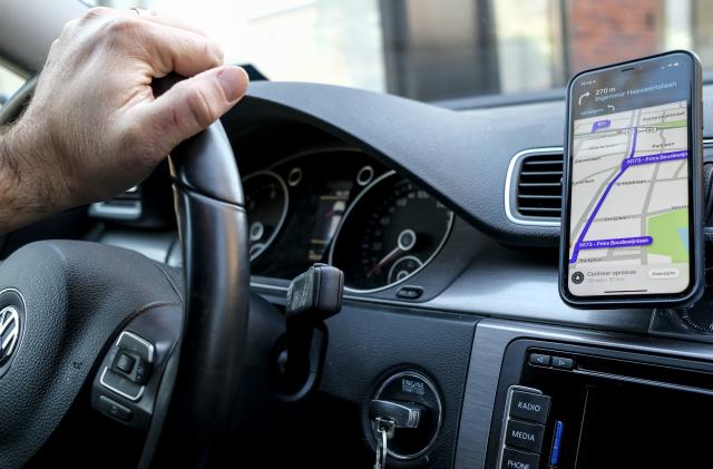 Illustration picture shows a telephone with Waze navigation app in Edegem, Thursday 26 March 2020. From March 18th, new measures are taken to avoid the spread of the Covid-19. BELGA PHOTO DIRK WAEM (Photo by DIRK WAEM/BELGA MAG/AFP via Getty Images)