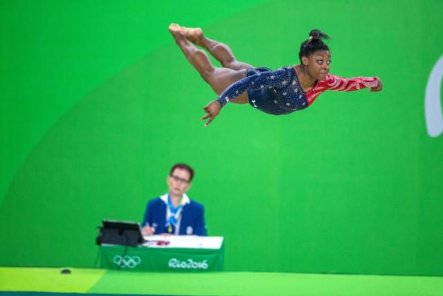 Simone Biles of the United States performing her floor routine during the Artistic Gymnastics Women's Qualification round at the Rio Olympic Arena on August 7, 2016 in Rio de Janeiro, Brazil. (Photo by Tim Clayton/Corbis via Getty Images)