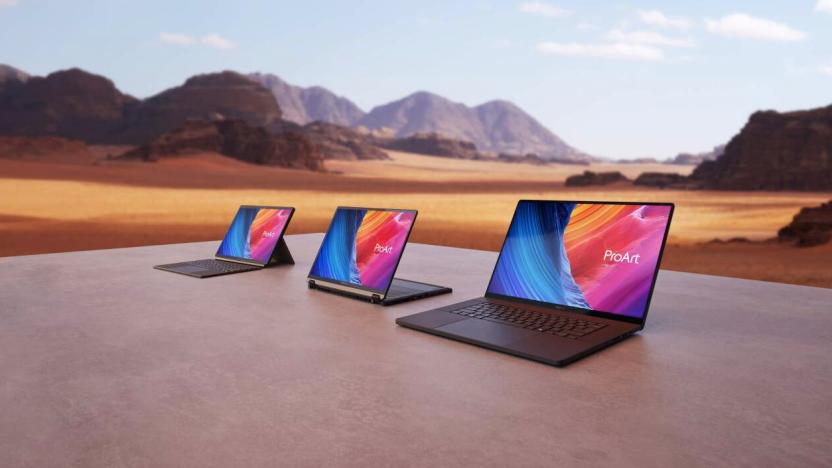 Three laptops outside in the desert for some reason. 