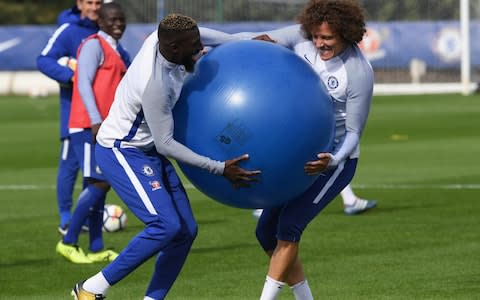 Tiemoue Bakayoko larks around with David Luiz - Credit: Getty