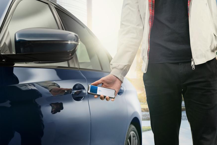 iPhone digital car key unlocking a BMW vehicle