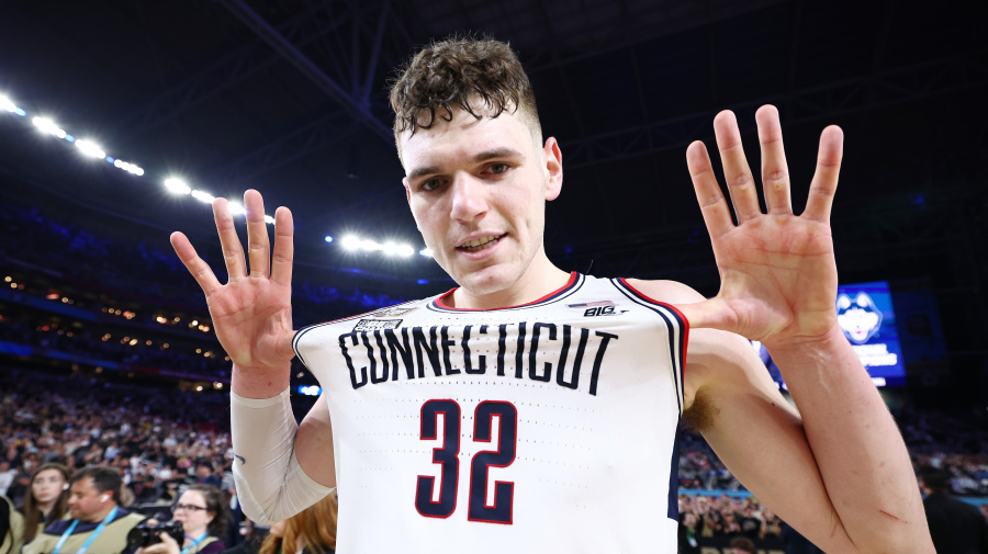 Getty Images - GLENDALE, ARIZONA - APRIL 08: Donovan Clingan #32 of the Connecticut Huskies celebrates after defeating the Purdue Boilermakers in the NCAA Men's Basketball Tournament National Championship game at State Farm Stadium on April 08, 2024 in Glendale, Arizona. (Photo by Jamie Schwaberow/NCAA Photos via Getty Images)