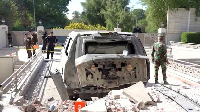 A destroyed vehicle is parked in front of Iraqi Prime Minister Mustafa al-Kadhimi's residence following an assassination attempt by an armed drone in Baghdad, Iraq in this screen grab taken from a handout video obtained by Reuters on November 7, 2021. PRIME MINISTER MEDIA OFFICE/Handout via REUTERS THIS IMAGE HAS BEEN SUPPLIED BY A THIRD PARTY. MANDATORY CREDIT