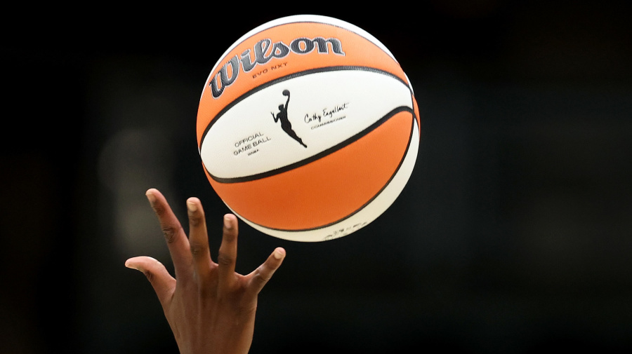 Getty Images - SEATTLE, WASHINGTON - JUNE 20: A detail of the WNBA logo is seen on the basketball during opening tipoff between the Seattle Storm and the Connecticut Sun at Climate Pledge Arena on June 20, 2023 in Seattle, Washington. (Photo by Steph Chambers/Getty Images)