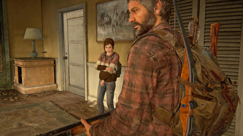 A still image from the video game 'The Last of Us: Part 1' for PC showing Ellie and Joel standing in the living room of an abandoned house.