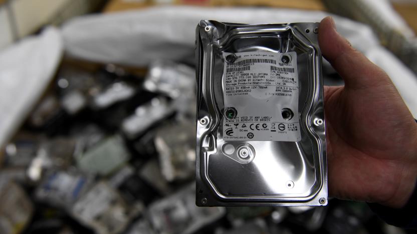 This photo taken on January 19, 2017 shows an employee displaying a physically destroyed hard disk drive at the Tokyo Eco Recycle company in Tokyo.
Electronic waste is rising sharply across Asia as higher incomes allow hundreds of millions of people to buy smartphones and other gadgets, with serious consequences for human health and the environment, according to a UN study released on January 15.
 / AFP PHOTO / TOSHIFUMI KITAMURA        (Photo credit should read TOSHIFUMI KITAMURA/AFP via Getty Images)