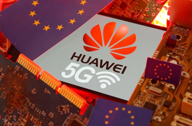 The EU flag and a smartphone with the Huawei and 5G network logo are seen on a PC motherboard in this illustration taken January 29, 2020. REUTERS/Dado Ruvic/Illustration