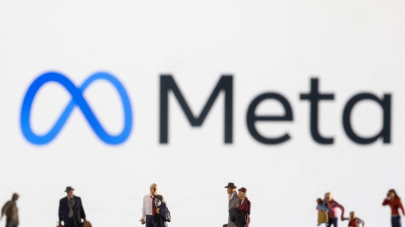 Small figurines are seen in front of displayed Meta logo in this illustration taken February 11, 2022. REUTERS/Dado Ruvic/Ilustration