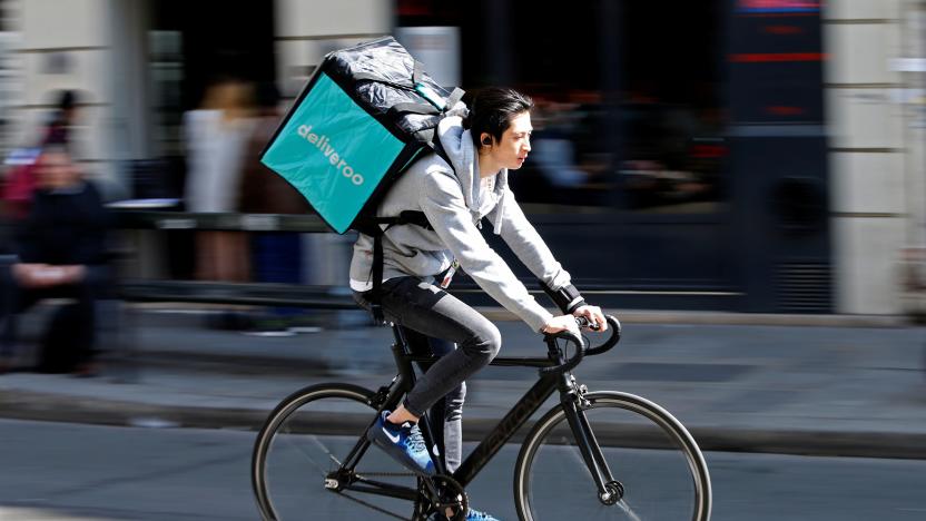 A cyclist rides a bicyle as he delivers food for Deliveroo, an example of the emergence of what is known as the 'gig economy', in Paris, France, April 7, 2017. Picture taken April 7, 2017. REUTERS/Charles Platiau