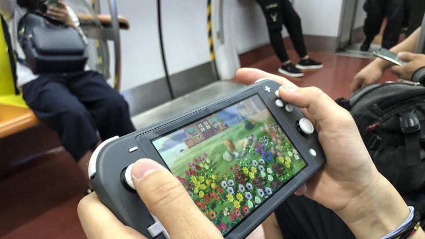 BEIJING, CHINA - JUNE 14: A passenger uses a Nintendo Switch to play video game 'Animal Crossing: New Horizons' on a subway train of Beijing Subway Line 1 on June 14, 2020 in Beijing, China. (Photo by VCG/VCG via Getty Images)