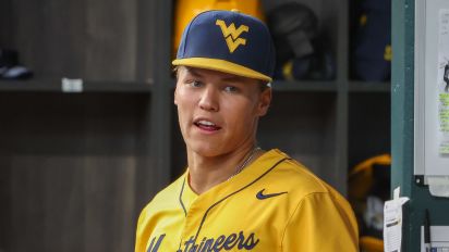 Getty Images - ARLINGTON, TX - MAY 22: West Virginia infielder J.J. Wetherholt (27) stands in the dugout during the 2024 Phillips 66 Big 12 Baseball Championship game between West Virginia and Kansas State on May 22, 2024, at Globe Life Field in Arlington, TX. (Photo by David Buono/Icon Sportswire via Getty Images)