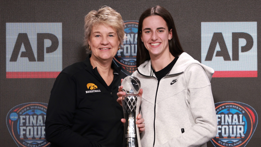 Getty Images - CLEVELAND, OHIO - APRIL 04: AP Player of the Year Caitlin Clark #22 of the Iowa Hawkeyes poses with her award and head coach Lisa Bluder during a press conference ahead of the 2024 NCAA Women's Basketball Tournament Final Four at Rocket Mortgage Fieldhouse on April 04, 2024 in Cleveland, Ohio. (Photo by Gregory Shamus/Getty Images)
