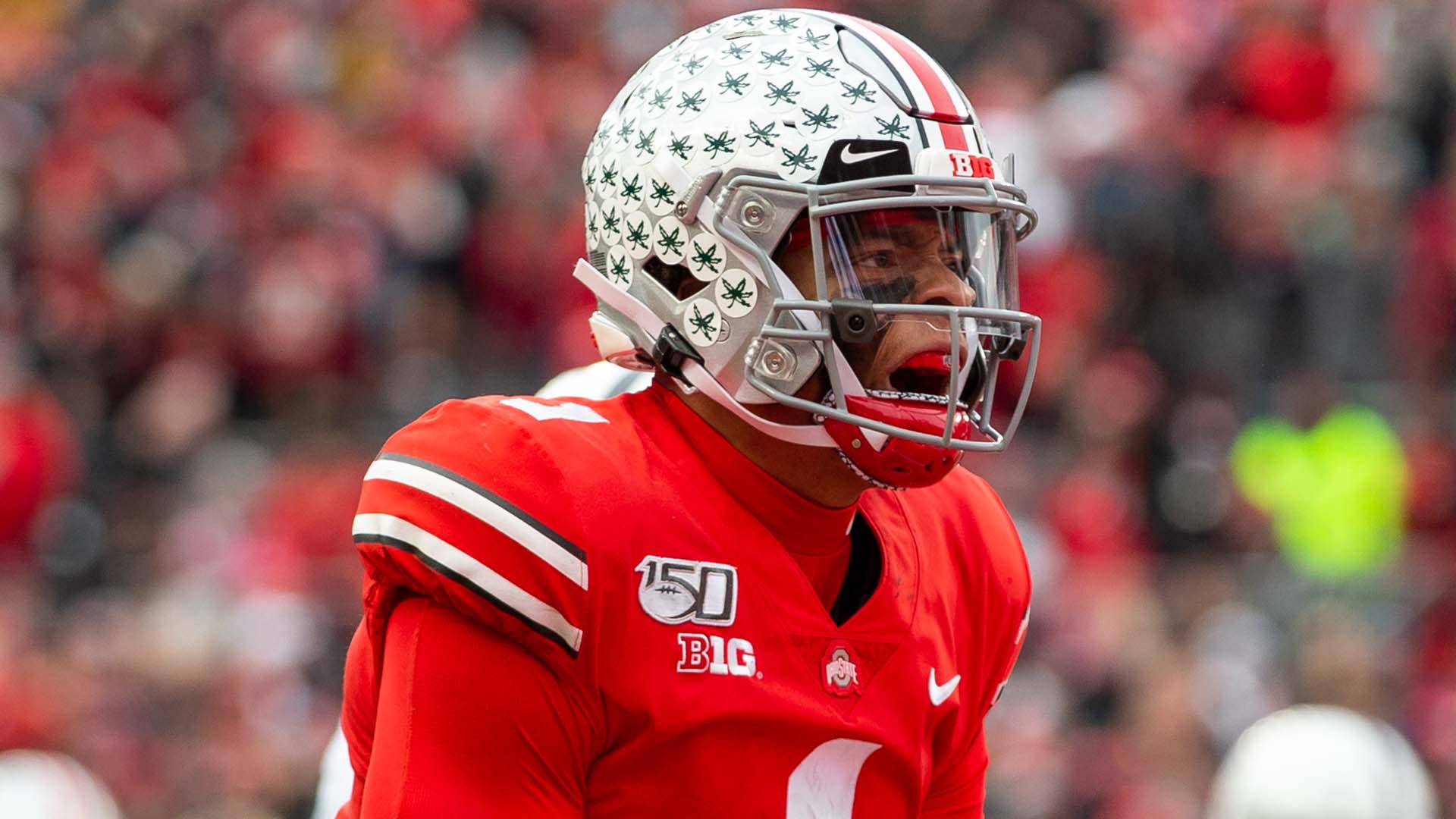 NEW ORLEANS, LA - JANUARY 01: Ohio State Buckeyes quarterback Justin Fields  (1) is tended to by medical staff after a targeting hit to his back during  the Allstate Sugar Bowl College