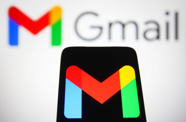 UKRAINE - 2021/12/15: In this photo illustration, the logo of Google mail, a free email service provided by Google is seen displayed on a smartphone and in the background. (Photo Illustration by Pavlo Gonchar/SOPA Images/LightRocket via Getty Images)