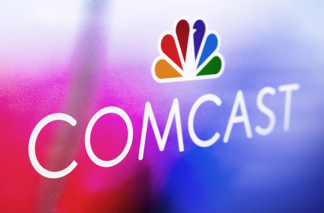 PHILADELPHIA, PA - APRIL 13: In this photo illustration, A Comcast logo is displayed at Comcast Center on April 13, 2021 in Philadelphia, Pennsylvania.  Comcast Corporation will host a conference call with the financial community to discuss financial results for the first quarter on Thursday, April 29, 2021 at 8:30 a.m. Eastern Time (ET). Comcast is a global media and technology company principally focused on broadband, aggregation, and streaming with over 56 million customer relationships across the United States and Europe, through its Xfinity, Comcast Business, and Sky brands. It also creates, distributes, and streams entertainment, sports, and news through Universal Filmed Entertainment Group, Universal Studio Group, Sky Studios, the NBC and Telemundo broadcast networks, multiple cable networks, Peacock, NBCUniversal News Group, NBC Sports, Sky News, and Sky Sports; and provide experiences at Universal Parks and Resorts in the United States and Asia. (Photo by Jeff Fusco/Getty Images for Comcast)