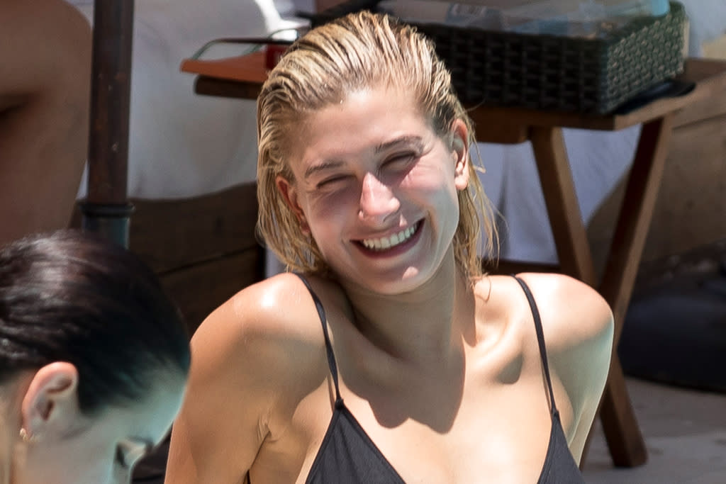 Hailey Baldwin’s Neon Bikini, Slouchy Sweats and Classic Nikes are the best vacation style