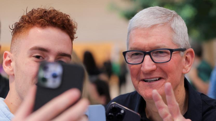 Apple CEO Tim Cook poses for a selfie at the Apple Fifth Avenue store for the release of the Apple iPhone 14 range in Manhattan, New York City, U.S., September 16, 2022.  REUTERS/Andrew Kelly