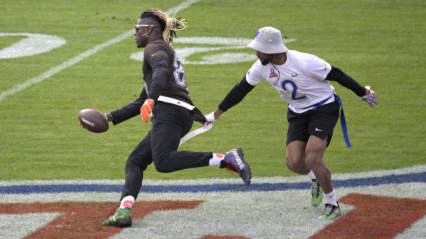 AFC tight end David Njoku (85), of the Cleveland Browns, runs after catching a pass as NFC defensive back Darius Slay (2) defends during the flag football event at the NFL Pro Bowl football game on Sunday, Feb. 4, 2024 in Orlando, Fla. (Phelan M. Ebenhack/AP Images for the NFL)