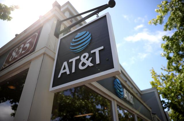 SAN RAFAEL, CALIFORNIA - MAY 17: A sign is posted in front of an AT&T retails store on May 17, 2021 in San Rafael, California. AT&T,  the world’s largest telecommunications company, announced a deal with Discovery, Inc. which will spin off AT&T's WarnerMedia and be combined with Discovery to create a new standalone media company. (Photo by Justin Sullivan/Getty Images)