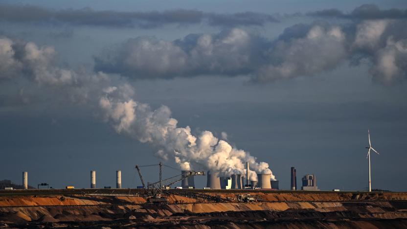 TOPSHOT - Open-cast lignite mining is seen near the coal-fired power station Neurath of German energy giant RWE in Garzweiler, western Germany, on October 27, 2021. - From October 31 to November 12, the 26th World Climate Conference (COP26) will take place in Glasgow, Scotland. Delegates from all over the world will meet there with the aim of pushing ahead more strongly with measures to combat the climate crisis. (Photo by Ina FASSBENDER / AFP) (Photo by INA FASSBENDER/AFP via Getty Images)